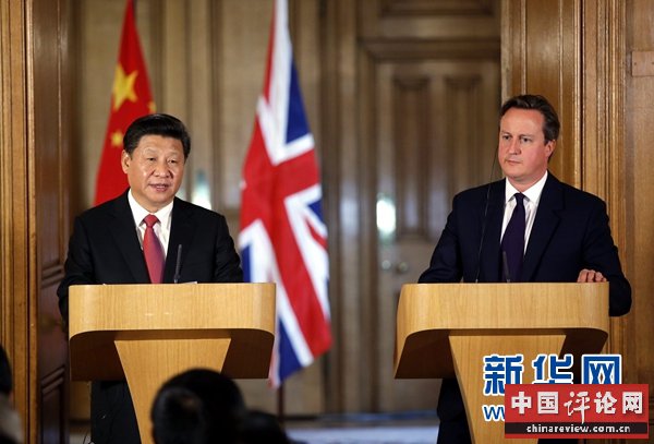 10月21日，国家主席习近平在伦敦唐宁街首相府同英国首相卡梅伦举行会谈。这是会谈结束后，习近平和卡梅伦共同会见记者。 新华社记者 鞠鹏 摄 